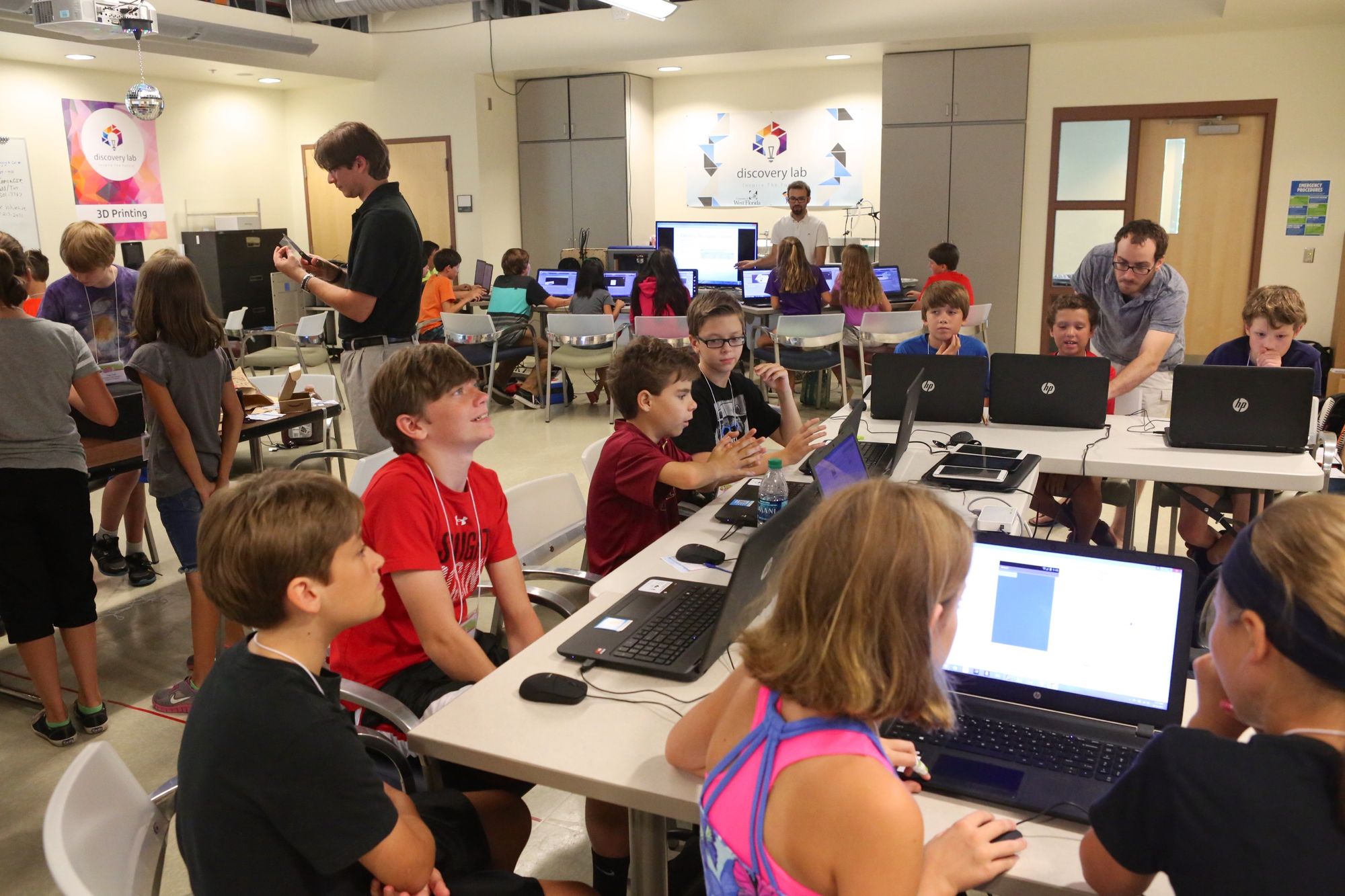 Students working on laptops during a Discovery Spot technology camp
