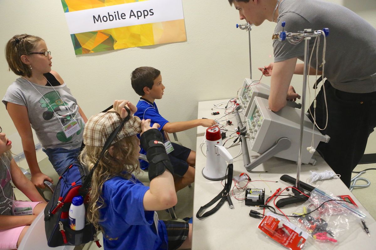 Students exploring laser communication and fiber optics