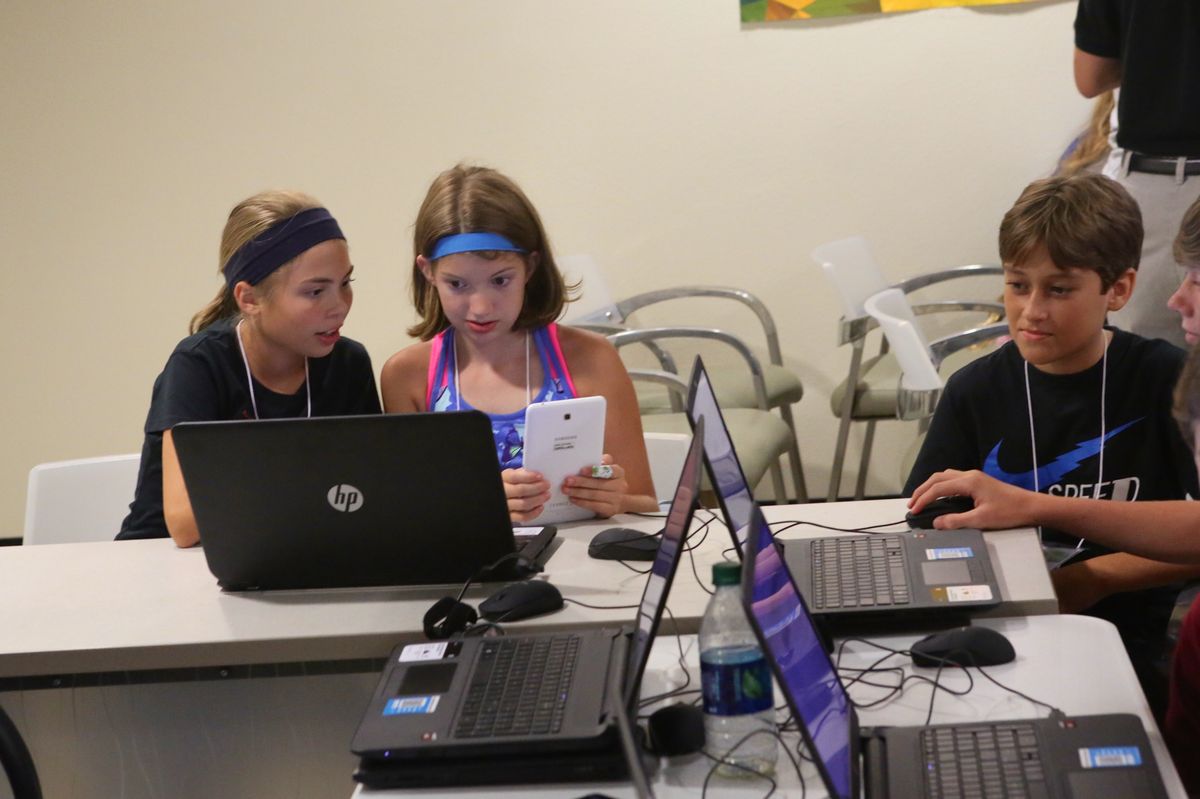 Two students testing a mobile app they built
